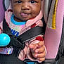 Jenesis joined the competition — help win amazing prizes! baby, child, car_seat, pink_bow, blue_clothing, seatbelt, toy, pacifier, infant, cute, tongue_out, playful, close_up, indoors, safety, person, smiling, jacket, hand, happy