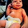 Hansen is registered to the contest to win money with this photo: baby, bodypart, couch, cushion, diaper, electronics, face, finger, furniture, hand, head, homedecor, mobilephone, newborn, person, phone, photography, portrait, sitting, wrist