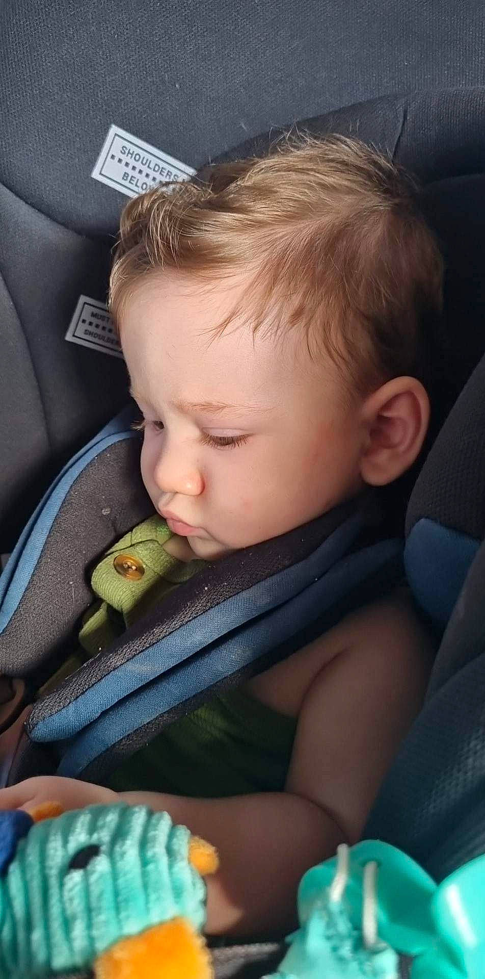 Brock is registered to the contest to win money with this photo: auto_part, baby, baby_in_car_seat, baby_products, baby_toddler_clothing, car_seat, car_seat_cover, cheek, child, comfort, ear, family_car, finger, head, mouth, nose, person, seat_belt, sitting, steering_wheel