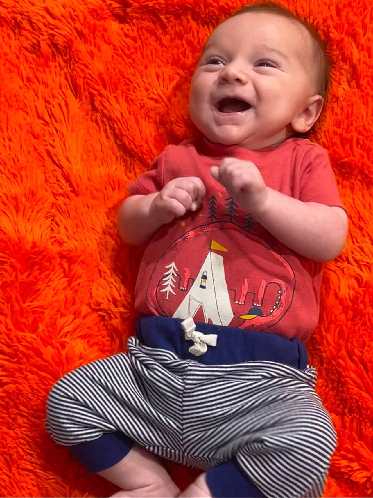 Connor joined the competition — help win amazing prizes! arm, baby, baby_toddler_clothing, chin, eye, facial_expression, finger, flash_photography, gesture, hand, happy, human_body, mouth, orange, organ, person, skin, sleeve, smile, t_shirt