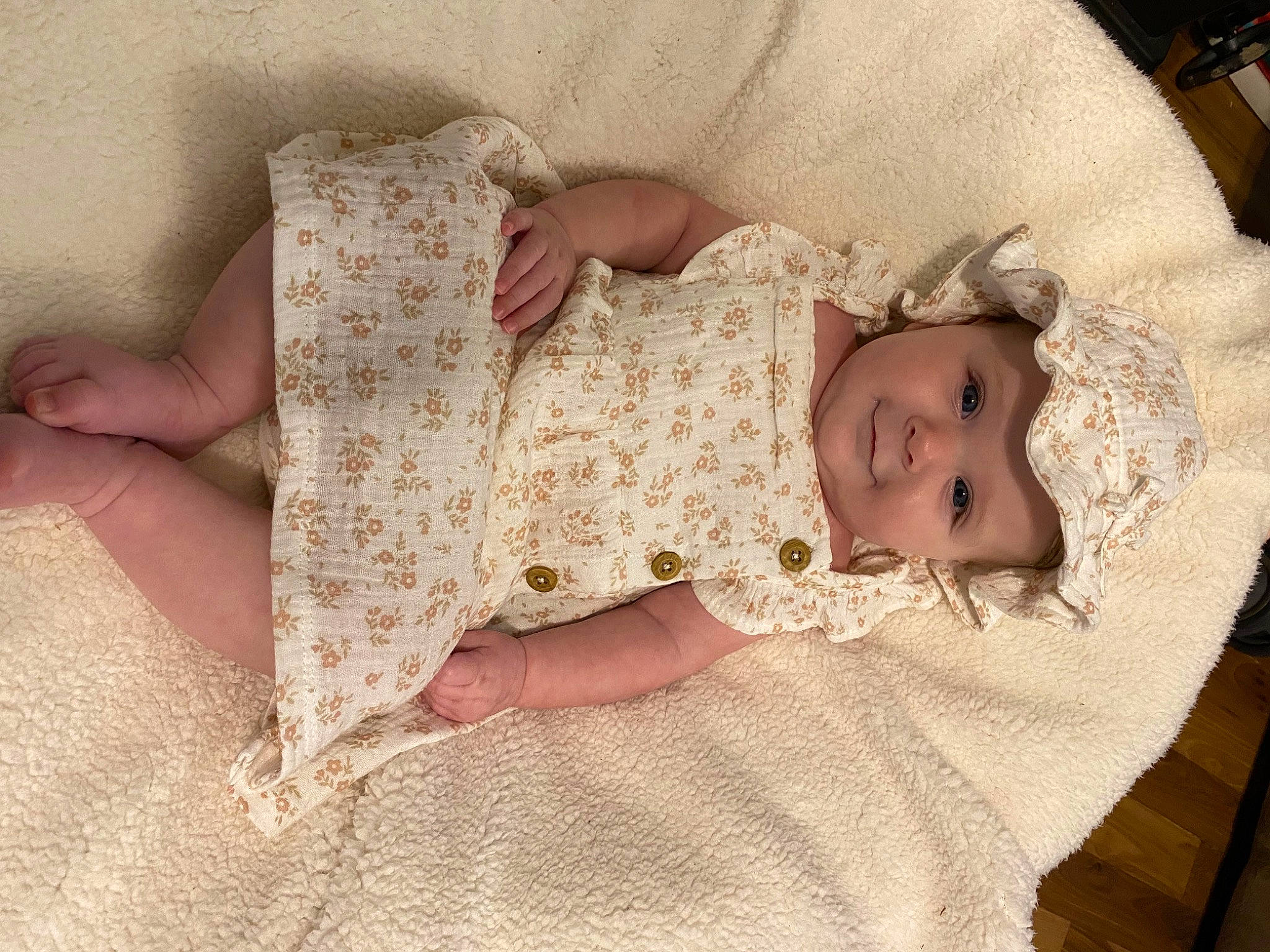 Emilee joined the competition — help win amazing prizes! arm, baby, baby_sleeping, baby_toddler_clothing, child, comfort, dress, embellishment, eye, finger, flooring, hand, headgear, headwear, iris, linens, pattern, person, skin, sleeve