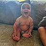 Cason joined the competition — help win amazing prizes! baby, child, smiling, happy, couch, indoor, window, diaper, skin, sitting, plush, arm, foot, natural_light, joyful, infant, person, furniture, living_room, casual