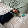 baby, bed, pillow, pacifier, infant, sleeping, clothing, blanket, person, child, nursery, rest, cute, soft, home, comfort, lying_down, peaceful, indoors, sleep