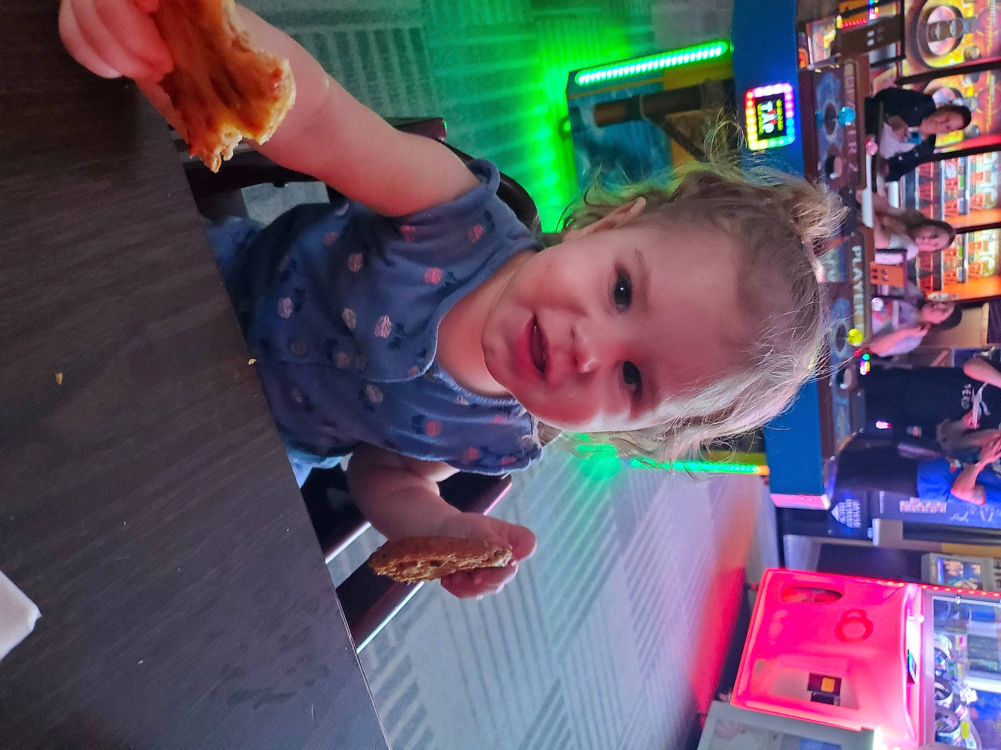 Elsa is registered to the contest to win money with this photo: child, event, fun, games, leisure, machine, party, person, play, recreation, recreation_room, room, shelf, shelving, smile, toddler, tree