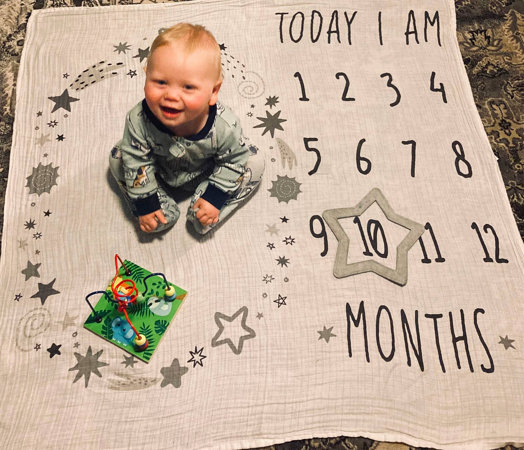 Bodhi is registered to the contest to win money with this photo: baby, baby_toddler_clothing, child, flooring, font, grass, happy, illustration, leaf, linens, pattern, people, people_in_nature, person, product, sleeve, smile, t_shirt, textile, toddler