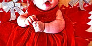 Lily-Rose participe au concours pour gagner de l'argent avec cette photo : baby, infant, red_dress, blanket, reindeer_pattern, silver_bows, holiday, christmas, festive, cute, lying_down, expression, wide_eyes, small_hands, cozy, soft_texture, indoors, person, portrait, holiday_season