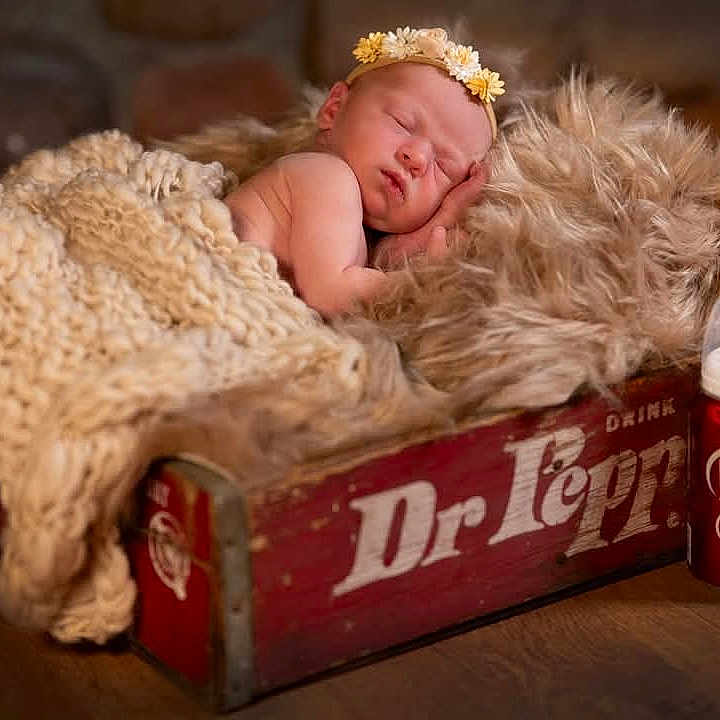 Ivy Claire is registered to the contest to win money with this photo: baby, beverage, blanket, blonde, can, coke, face, hair, happy, head, newborn, person, photography, portrait, sleeping, smile, soda, tin