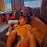 Navi joined the competition — help win amazing prizes! bottle, brown_dog, carpet, casual_clothing, child, childcare, companionship, couch, dog, domestic, family, furniture, indoor, living_room, pet, relaxing, resting, toddler, toy, window