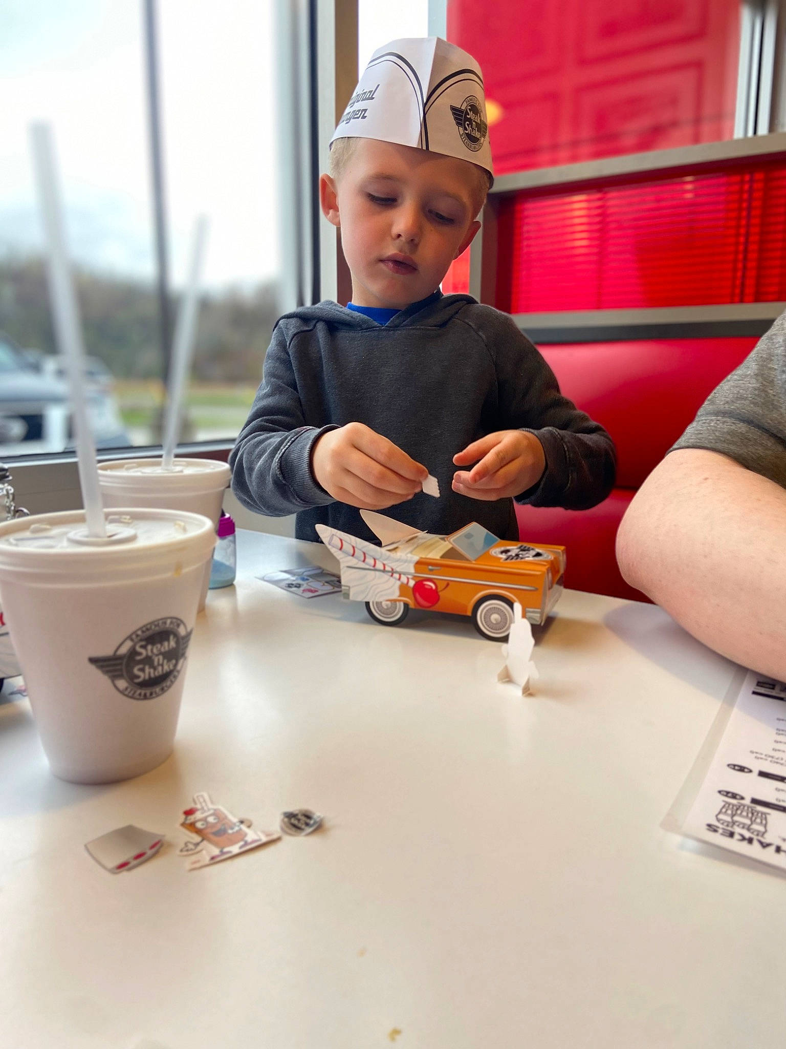 Gabriel joined the competition — help win amazing prizes! art, automotive_design, baseball_cap, cap, child, cup, engineering, fun, hand, hat, headwear, nail, person, play, recreation, t_shirt, table, toddler, toy, wheel