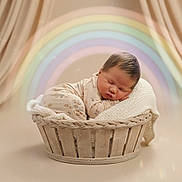 Astrid joined the competition — help win amazing prizes! baby, background, basket, blanket, child, cozy, cute, infant, knitted, newborn, pastel, peaceful, portrait, rainbow, serene, sleeping, soft, studio, warm, wrapped