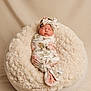 Astrid is registered to the contest to win money with this photo: adorable, baby, beige, child, cozy, cushion, cute, fabric, floral_pattern, headband, infant, newborn, peaceful, portrait, resting, sleeping, soft_texture, studio, swaddle, wrapped