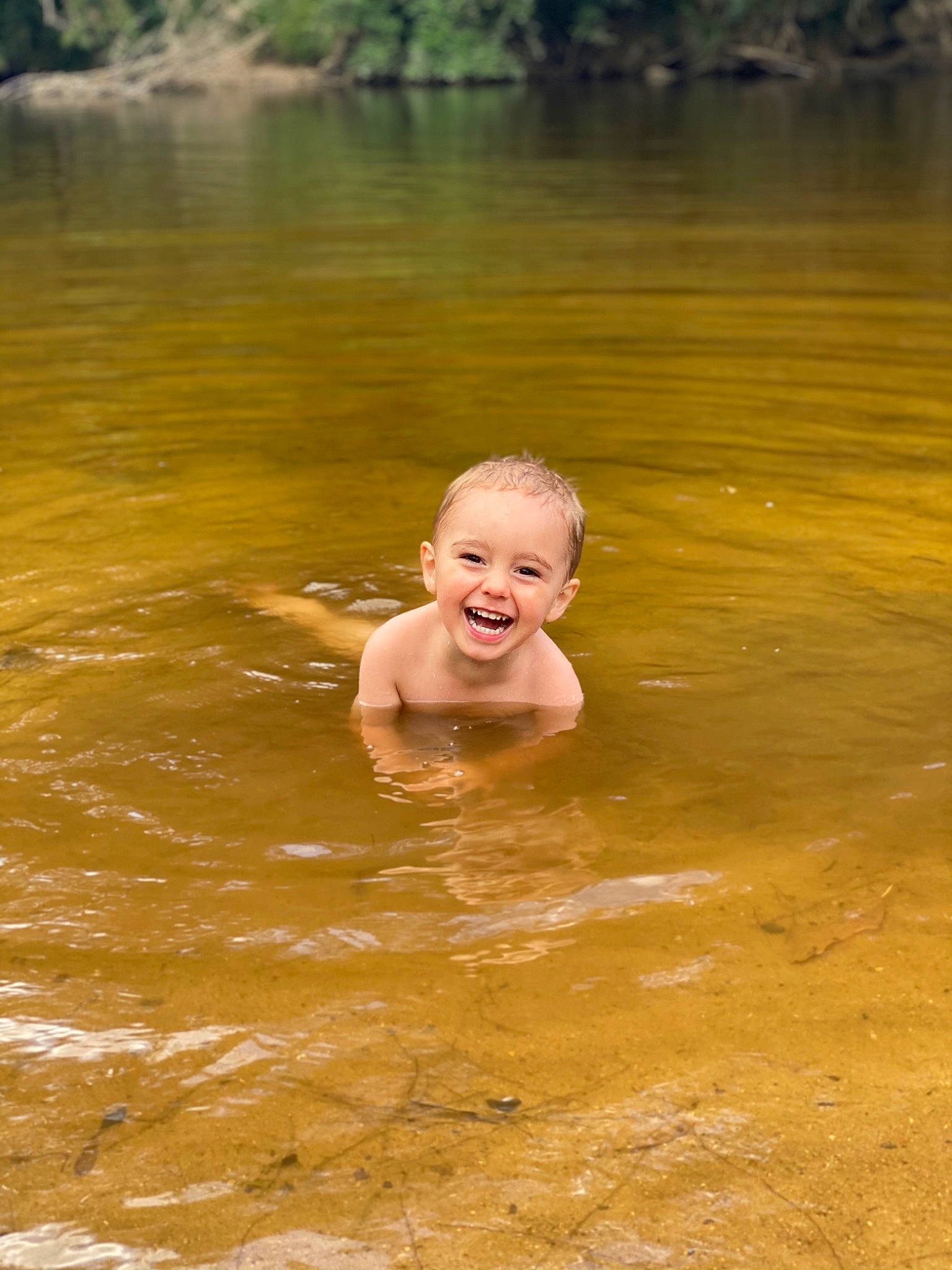 Kobi is registered to the contest to win money with this photo: baby, barechested, bathing, cheek, chest, child, ear, fluvial_landforms_of_streams, fun, holiday, joy, lake, leisure, muscle, person, river, summer, swimming, toddler, vacation