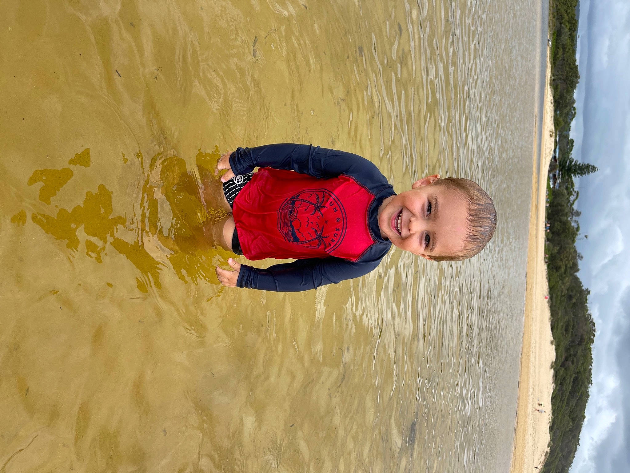 Kobi is registered to the contest to win money with this photo: beach, body_of_water, fun, happy, holiday, joy, leisure, people_in_nature, person, summer, toddler, vacation
