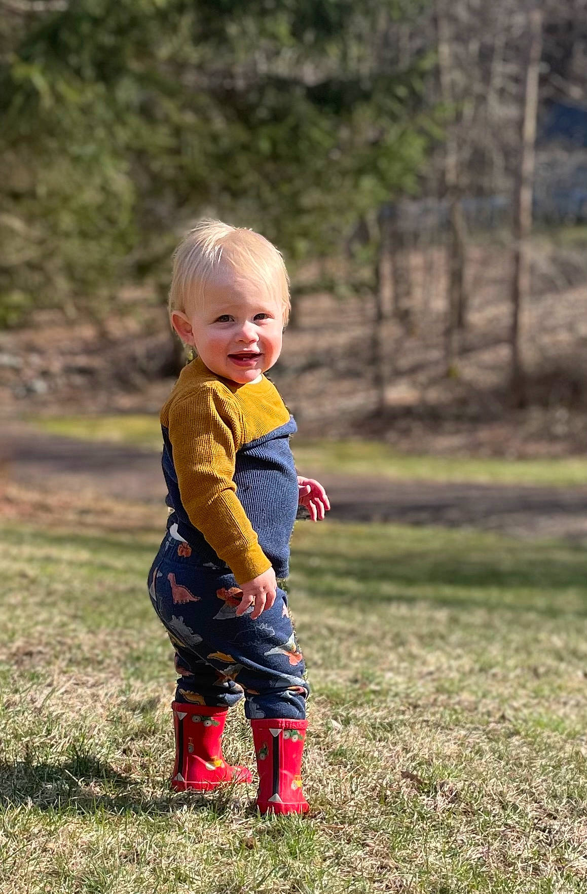 Colson is registered to the contest to win money with this photo: baby, baby_toddler_clothing, child, fun, grass, grassland, happy, joy, landscape, pattern, people_in_nature, person, plant, portrait_photography, prairie, recreation, sitting, smile, soil, toddler