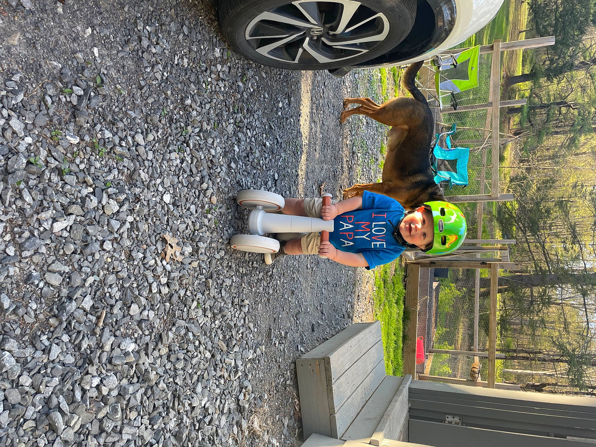 Colson is registered to the contest to win money with this photo: art, asphalt, automotive_tire, electric_blue, footwear, hat, headwear, hubcap, leisure, person, plant, road_surface, shorts, sidewalk, synthetic_rubber, tar, tire, tire_care, tree, vehicle