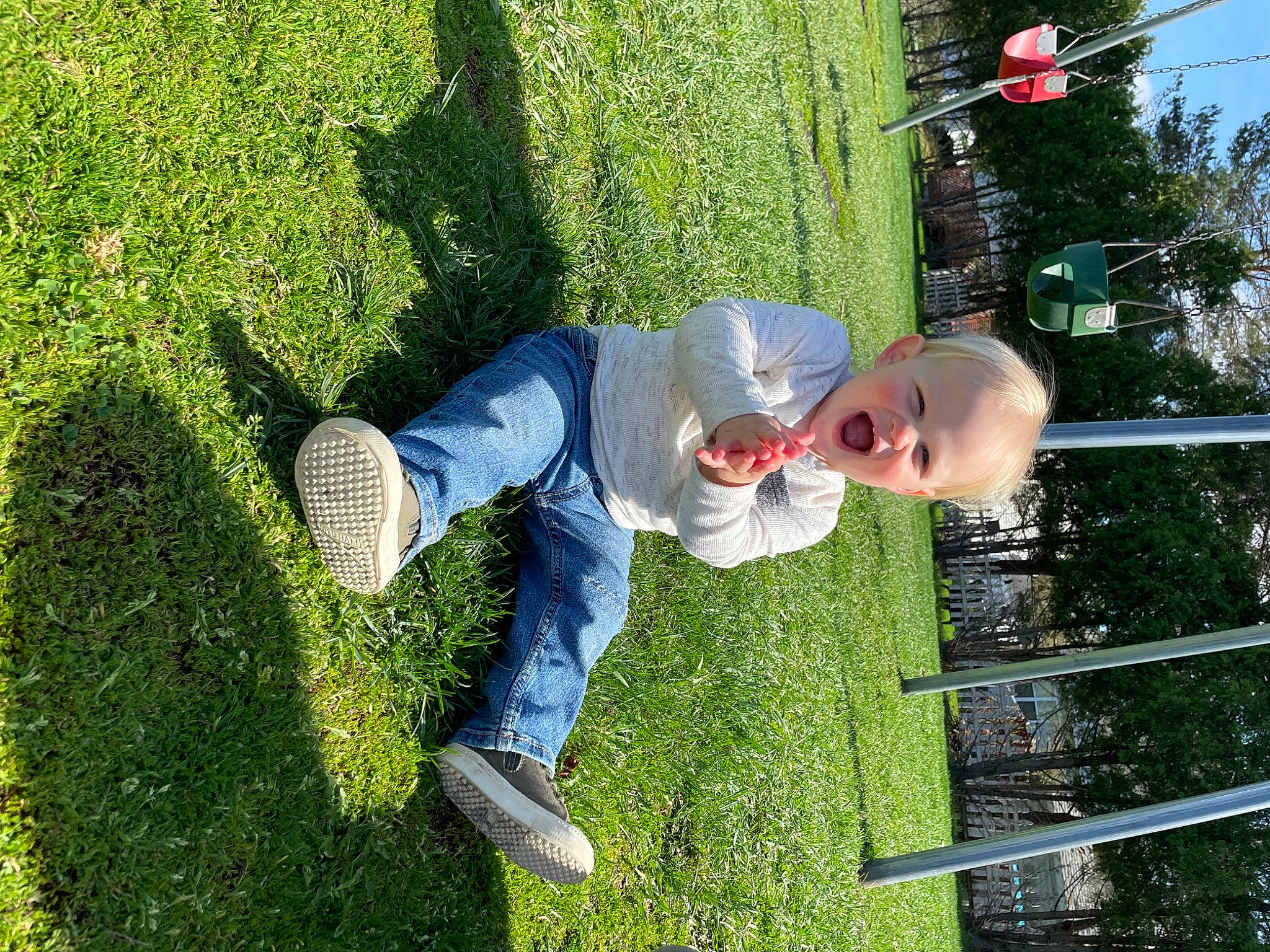 Colson is registered to the contest to win money with this photo: child, denim, fun, garden, grass, green, groundcover, happy, jeans, landscape, leisure, natural_environment, people_in_nature, person, plant, recreation, shadow, shrub, sky, toddler