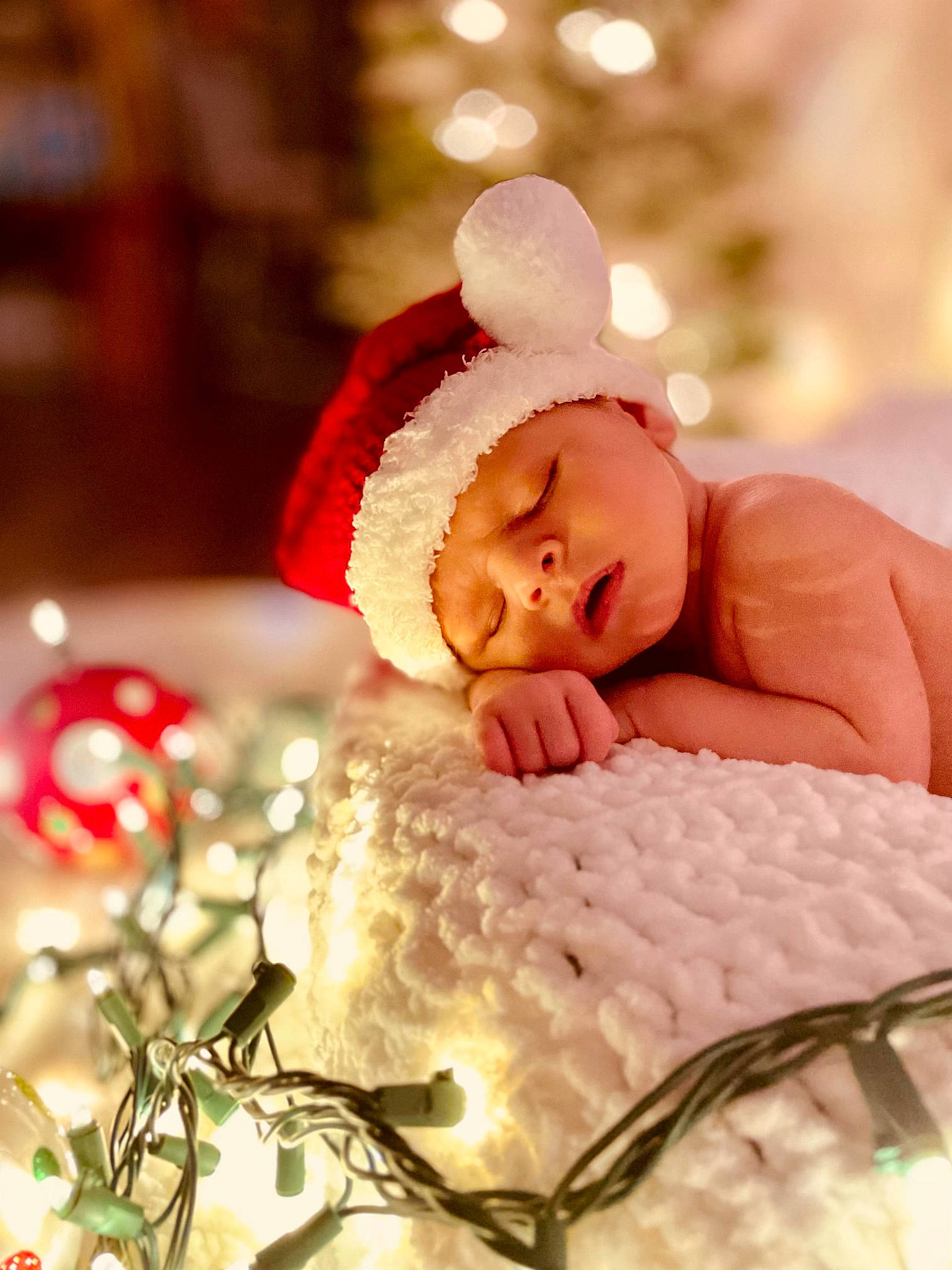 Jaxton joined the competition — help win amazing prizes! baby, baby_sleeping, baby_toddler_clothing, carmine, child, christmas, christmas_decoration, christmas_ornament, close_up, comfort, event, finger, happy, headwear, holiday, linens, ornament, person, petal, skin