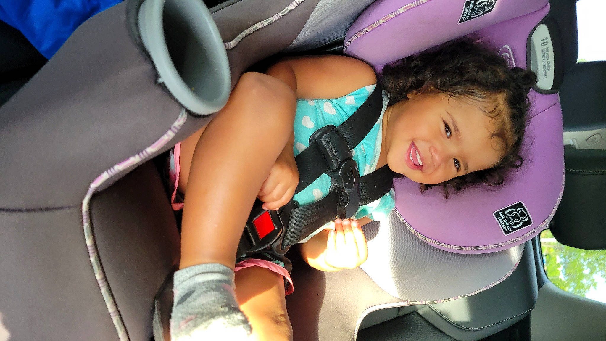 Eniyah is registered to the contest to win money with this photo: auto_part, automotive_design, automotive_wheel_system, black_hair, car_seat, comfort, eyelash, finger, fun, happy, human_leg, joy, knee, leisure, motor_vehicle, mouth, person, skin, smile, thigh
