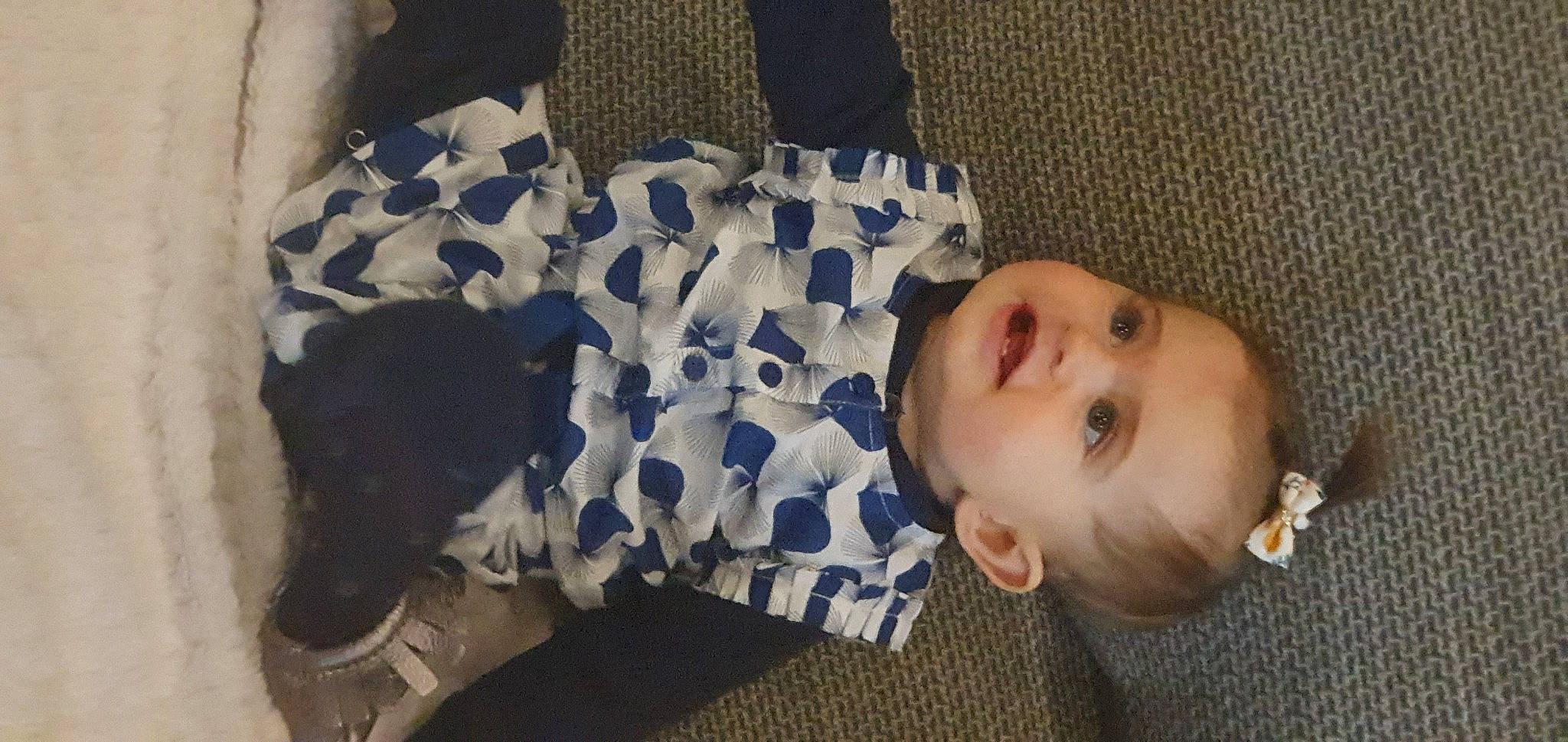 Liora participe au concours pour gagner de l'argent avec cette photo : arm, baby, baby_toddler_clothing, cheek, comfort, eye, facial_expression, finger, hand, head, human_body, iris, mammal, mouth, nose, person, skin, sleeve, textile, vertebrate