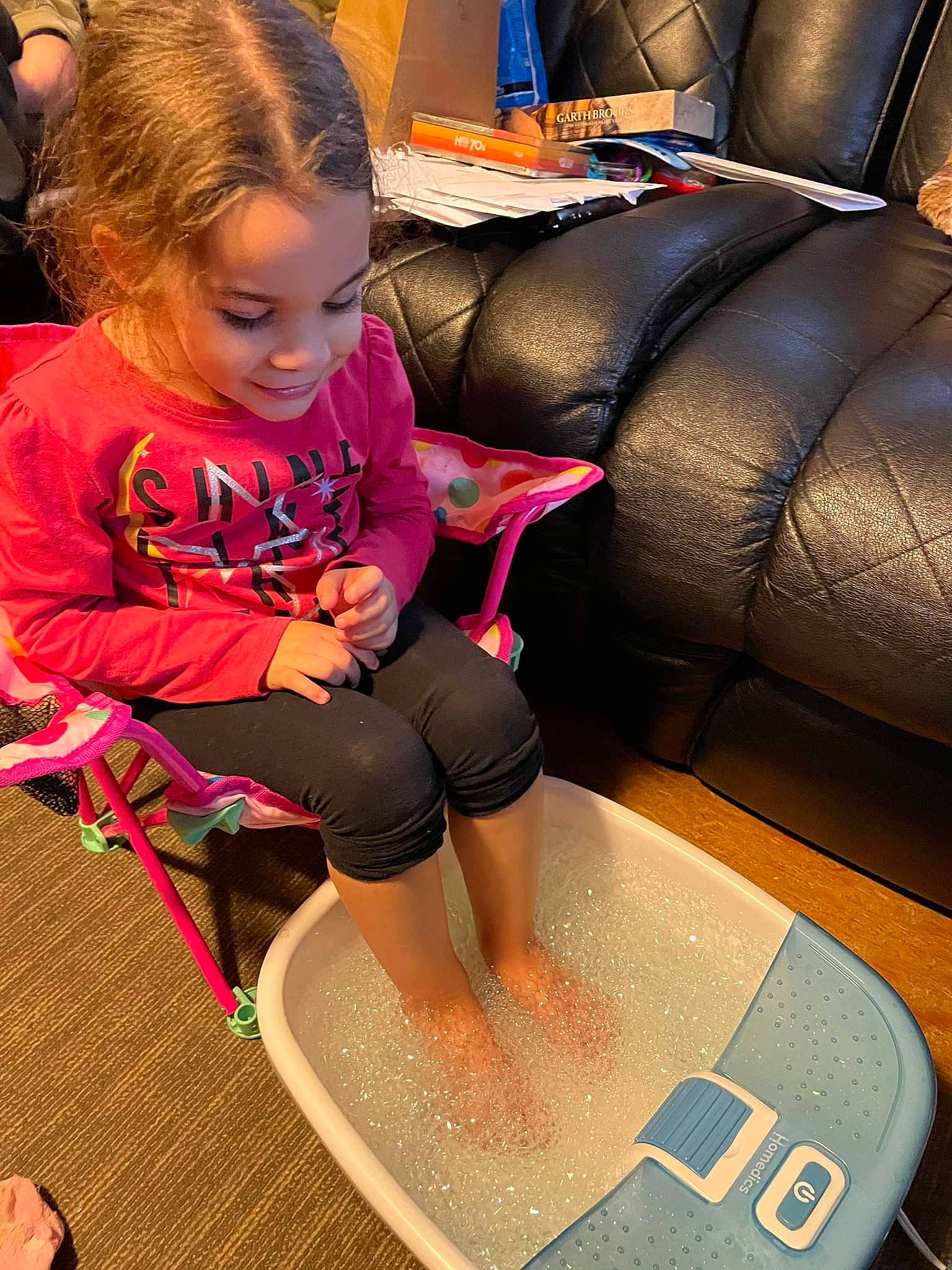 Kambrie joined the competition — help win amazing prizes! baby_toddler_clothing, barefoot, child, comfort, couch, floor, flooring, fun, human_leg, joy, knee, lap, leisure, person, play, room, shorts, sitting, t_shirt, thigh