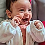 baby, infant, smiling, happy, child, face, eyes, clothing, jacket, heart_pattern, pink, gray, baby_seat, seatbelt, indoor, cute, joyful, expression, small_hands, zipped_jacket