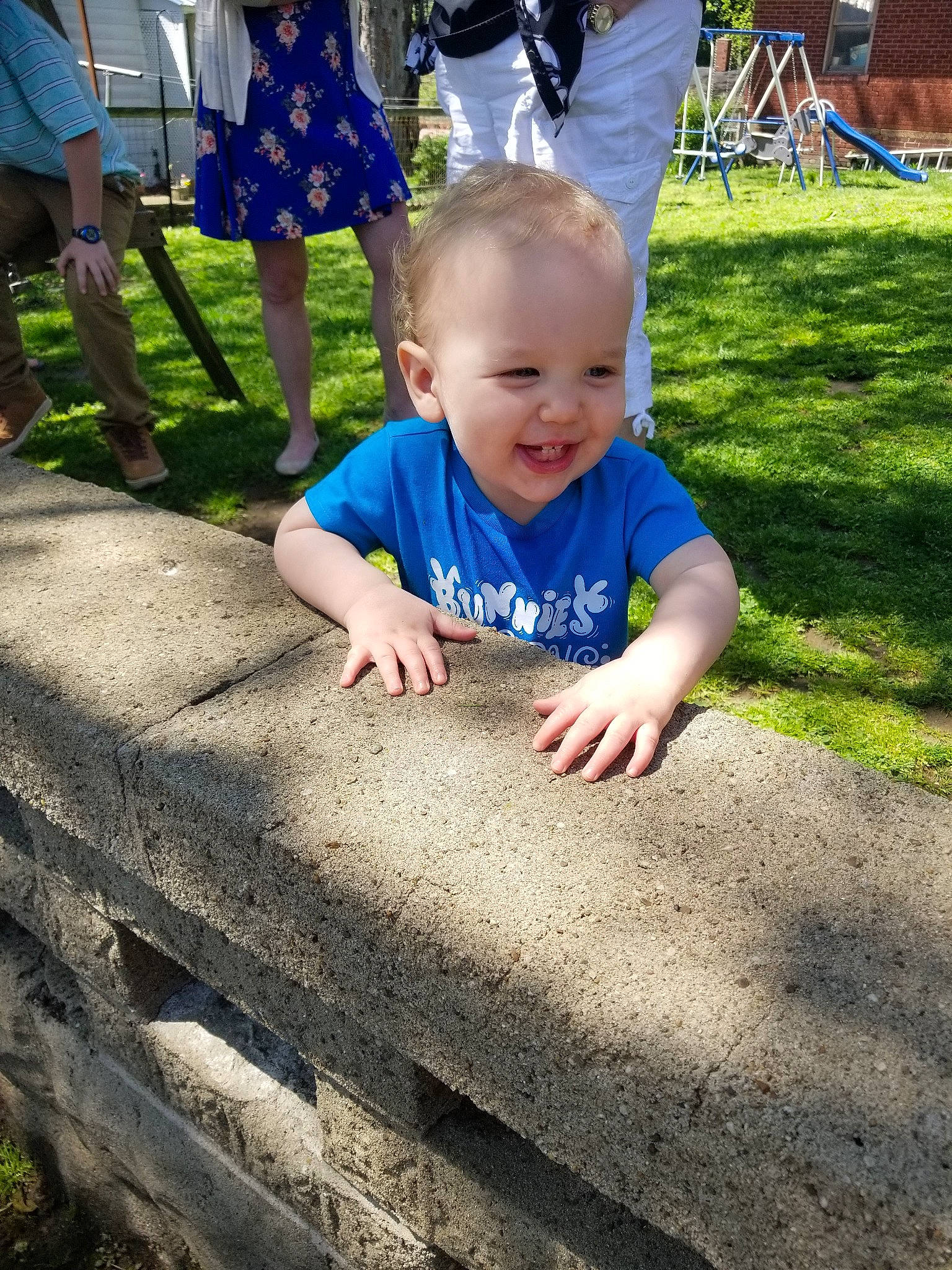 Jayden is registered to the contest to win money with this photo: child, fun, grass, joy, lawn, leaf, outdoor_play_equipment, person, plant, play, playground, public_space, recreation, sitting, smile, soil, summer, toddler, tree, vacation
