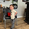 Jaxon joined the competition — help win amazing prizes! blackboard, boy, child, clothing, face, footwear, furniture, head, indoors, interiordesign, jeans, male, pants, person, photography, portrait, shoe, sitting, table, wood