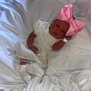 Julie joined the competition — help win amazing prizes! newborn, baby, infant, pink_bow, white_dress, socks, hospital_wristband, lying_down, soft_fabric, portrait, cute, sleepy, peaceful, indoors, child, headband, small_hands, baby_clothes, resting, closeup