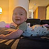 Walter joined the competition — help win amazing prizes! baby, infant, smile, bed, indoor, lamp, luggage, room, happy, child, clothing, crawling, furniture, portrait, cute, young_child, home, cozy, light, person