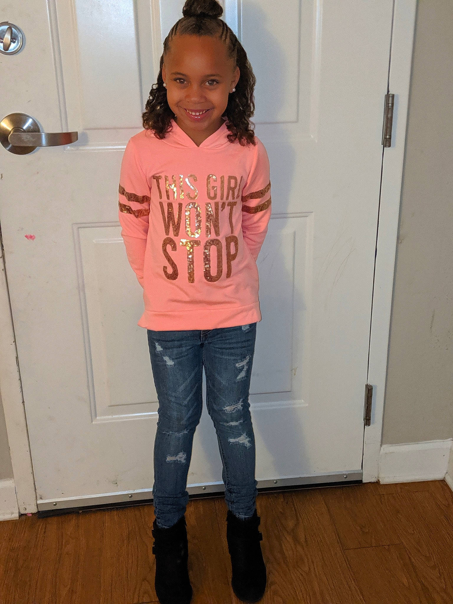 Storm is registered to the contest to win money with this photo: boot, child, clothing, denim, footwear, jacket, jeans, joint, joy, knee, outerwear, person, pink, riding_boot, shoe, shoulder, sleeve, standing, t_shirt, top