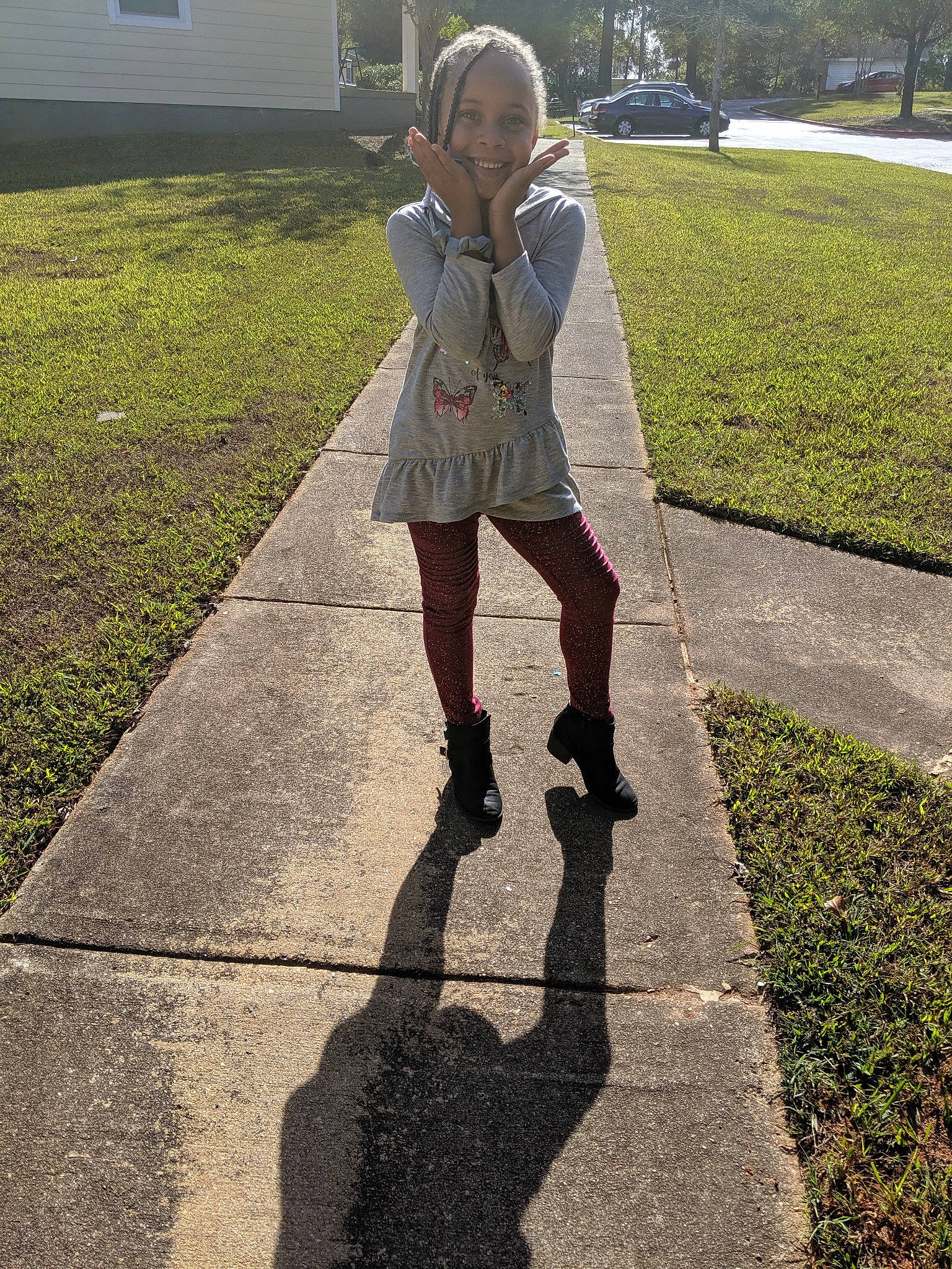 Storm joined the competition — help win amazing prizes! child, dress, fashion_accessory, footwear, grass, jacket, joy, lawn, leg, outerwear, person, photography, plant, road_surface, shadow, shoe, sidewalk, thigh, toddler, tree