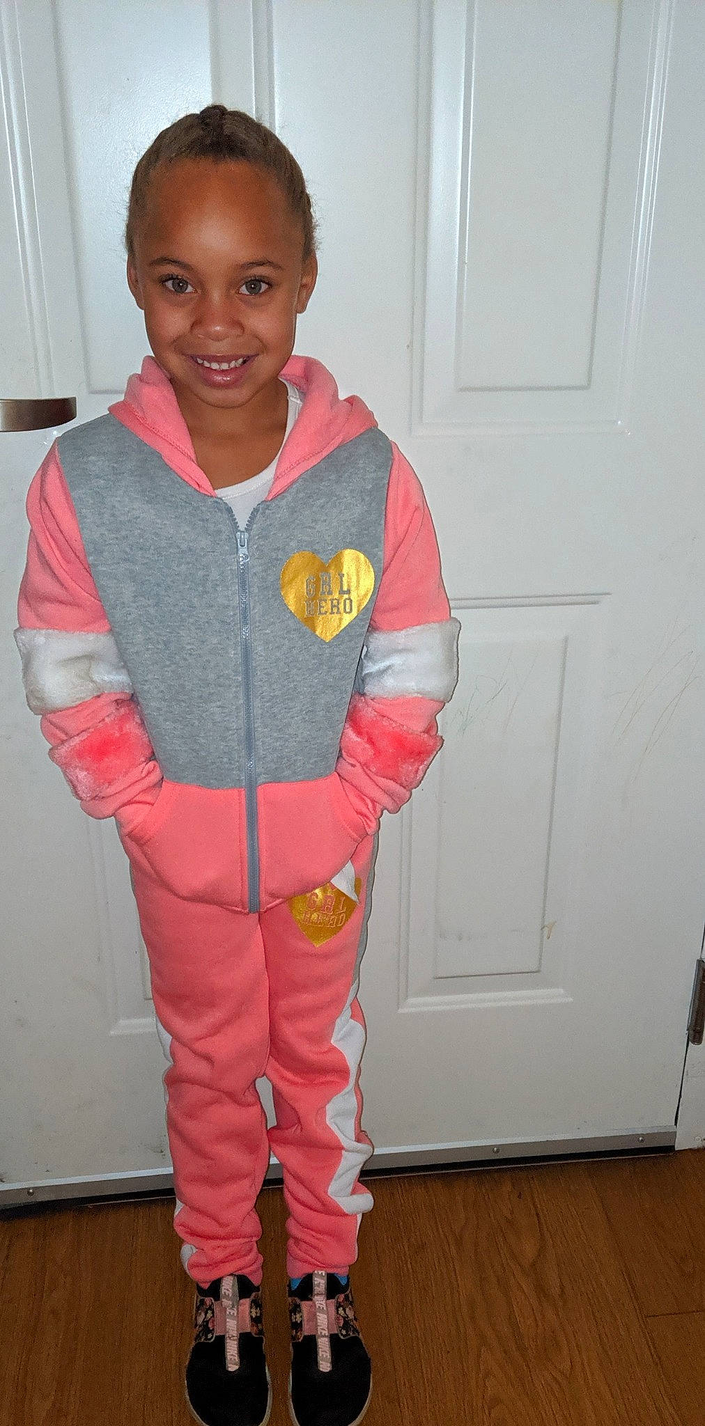 Storm is registered to the contest to win money with this photo: child, clothing, costume, hoodie, jacket, joy, outerwear, pajamas, person, pink, sleeve, standing, toddler