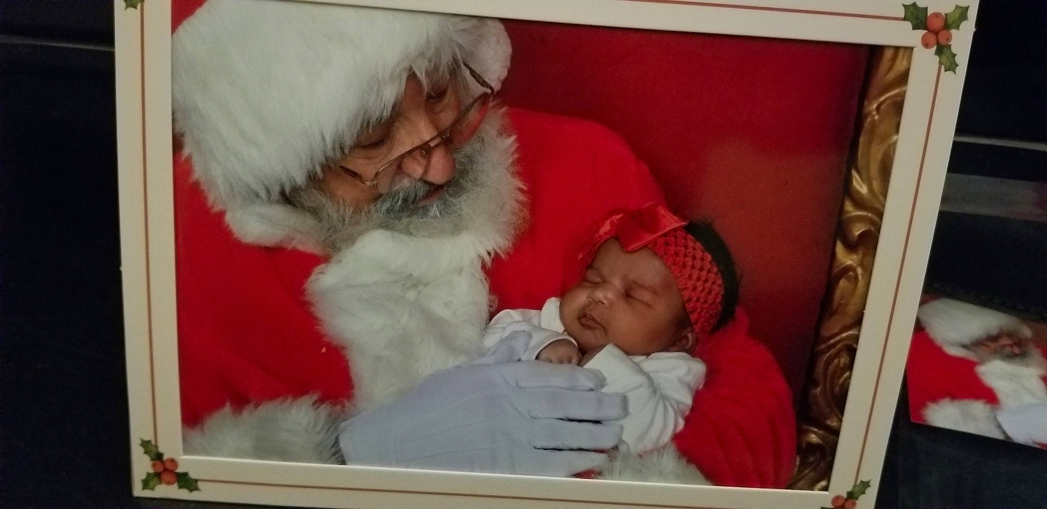 Isabella Meshelle joined the competition — help win amazing prizes! baby, beard, child, comfort, event, facial_hair, fun, fur, fur_clothing, happy, hat, head, headgear, headwear, holiday, lap, moustache, organ, person, room