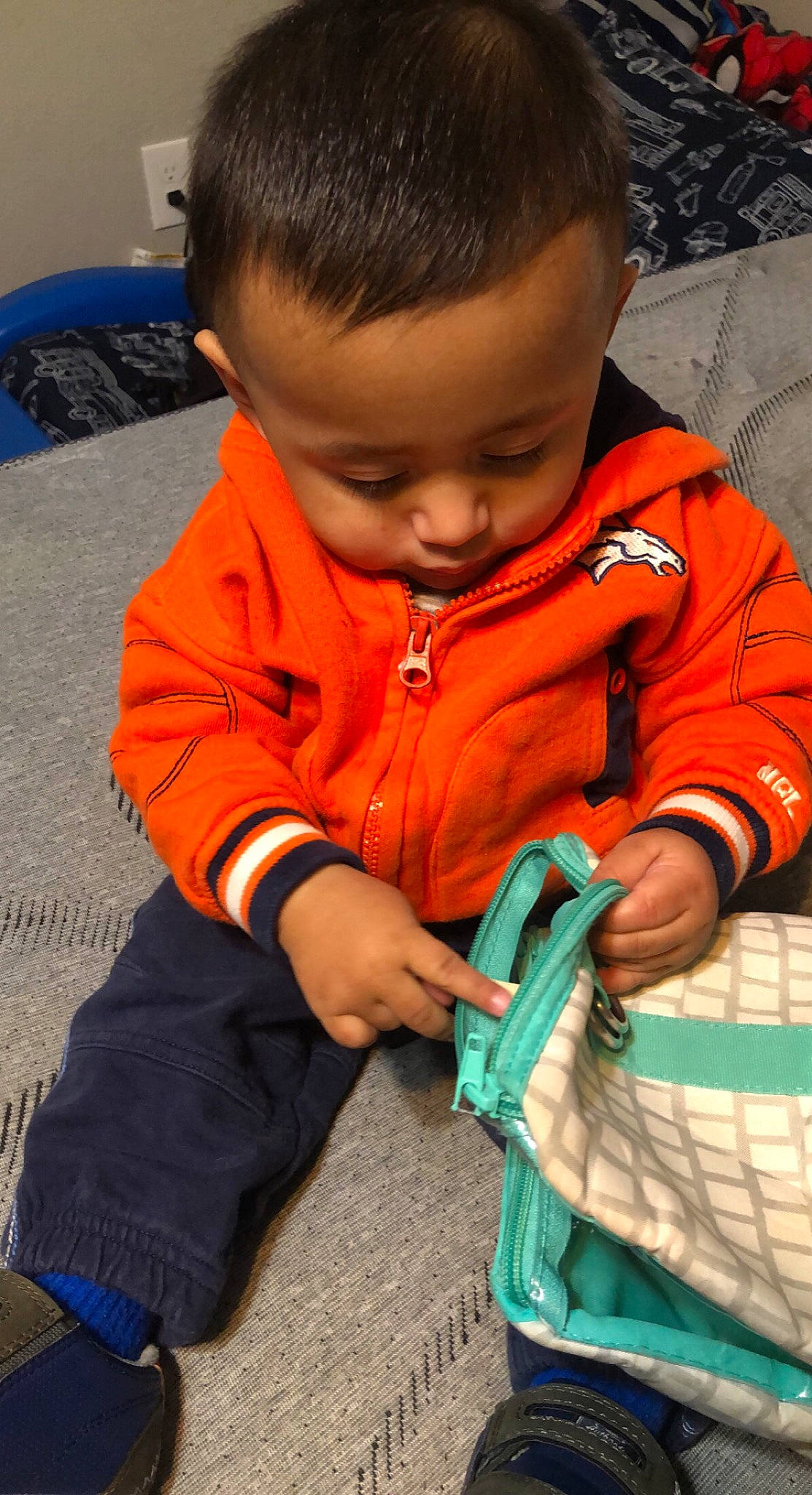 Gael joined the competition — help win amazing prizes! arm, baby, baby_toddler_clothing, blue, cheek, child, eye, finger, flooring, fun, hand, head, human_body, iris, nose, orange, outerwear, person, skin, sleeve