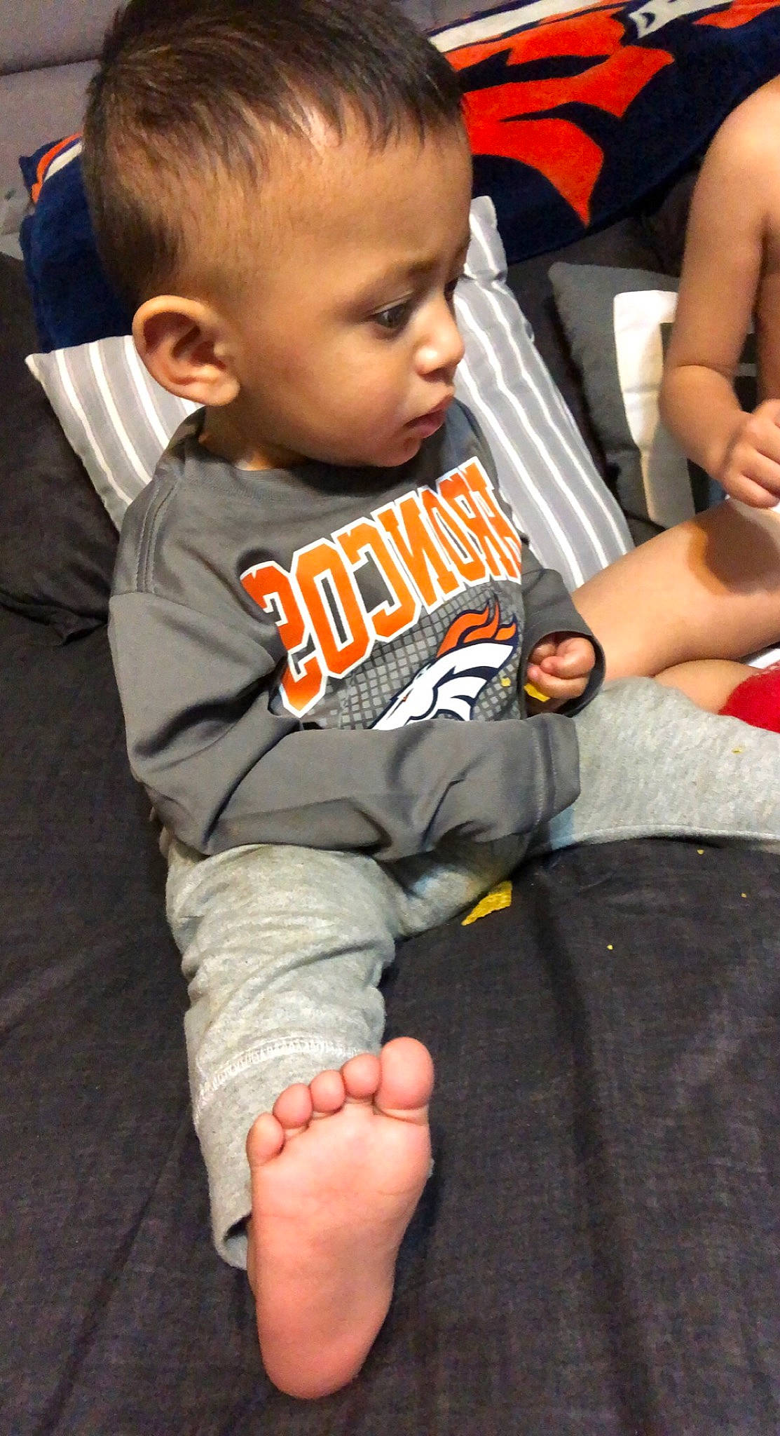 Gael joined the competition — help win amazing prizes! arm, black, eye, face, facial_expression, finger, flooring, hairstyle, head, joint, muscle, orange, organ, person, photograph, shorts, skin, sleeve, thigh, toddler