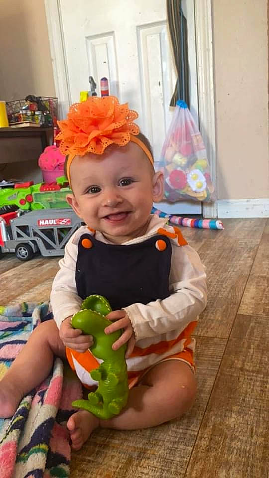Vira joined the competition — help win amazing prizes! amphibian, baby, baby_products, baby_toddler_clothing, baby_toys, child, costume, fashion_accessory, flooring, fun, happy, joy, person, pink, sitting, skin, smile, stuffed_toy, toddler, toy