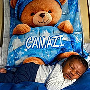 Camazi joined the competition — help win amazing prizes! newborn, baby, sleeping, teddy_bear, stuffed_animal, blanket, bed, blue, star_pattern, cozy, portrait, indoors, nursery, infant, lying_down, peaceful, clothing, pajamas, plush_toy, nap