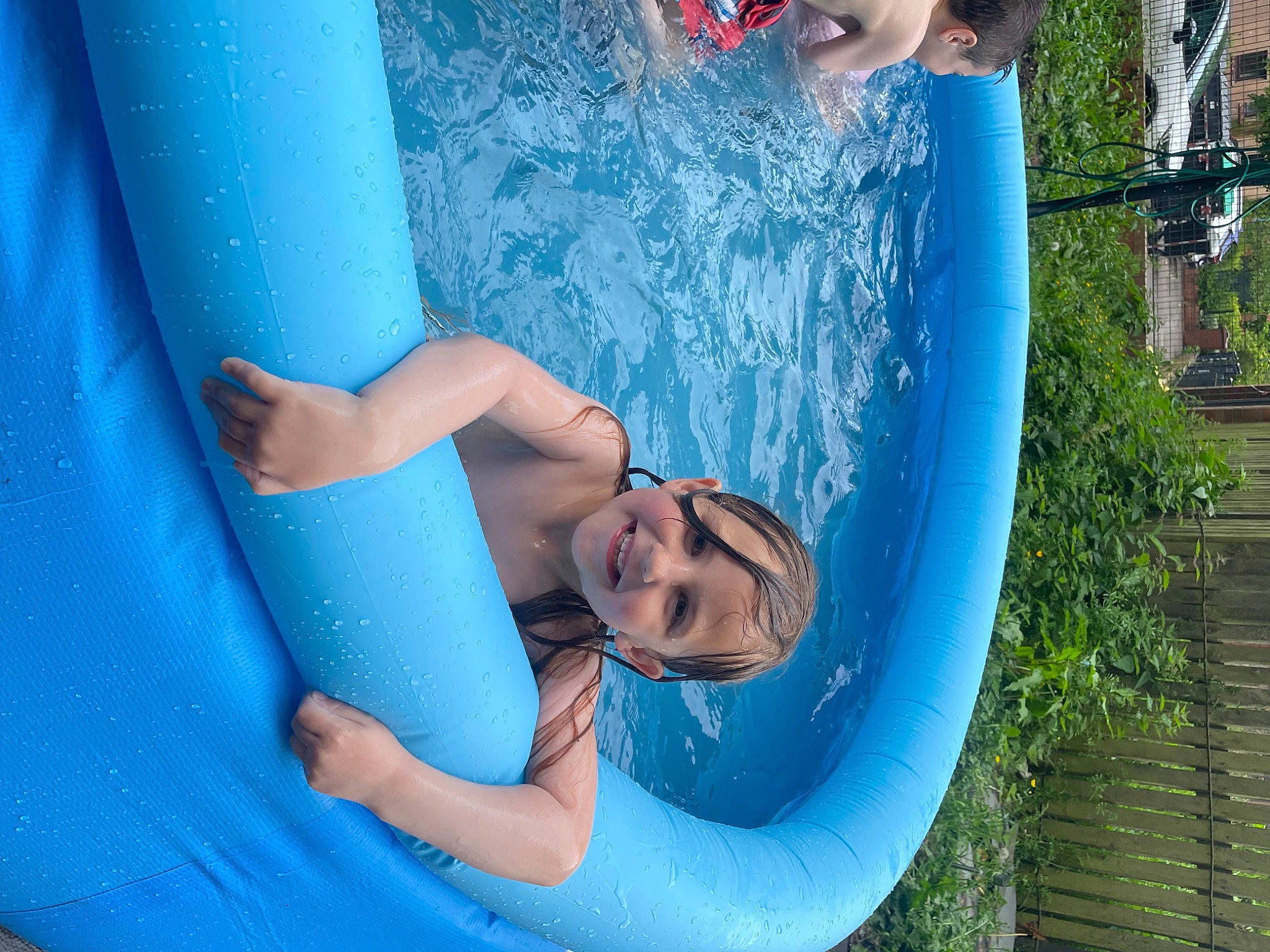 Olivia joined the competition — help win amazing prizes! aqua, azure, bathing, blue, child, elbow, electric_blue, fun, green, happy, human_leg, inflatable, joy, leisure, nonbuilding_structure, outdoor_recreation, person, recreation, red, swimming_pool
