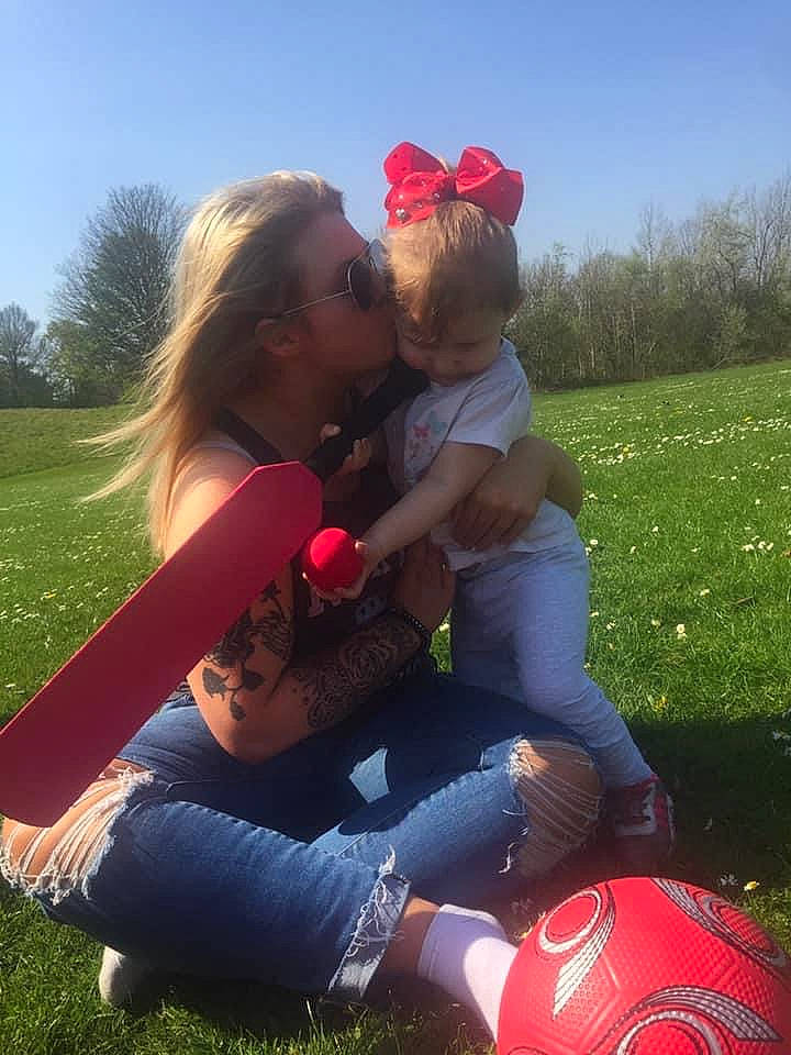 Olivia joined the competition — help win amazing prizes! ball, cool, football, fun, gesture, grass, happy, jeans, leisure, morning, people_in_nature, person, photograph, plant, red, shorts, sky, sports_equipment, summer, sunlight