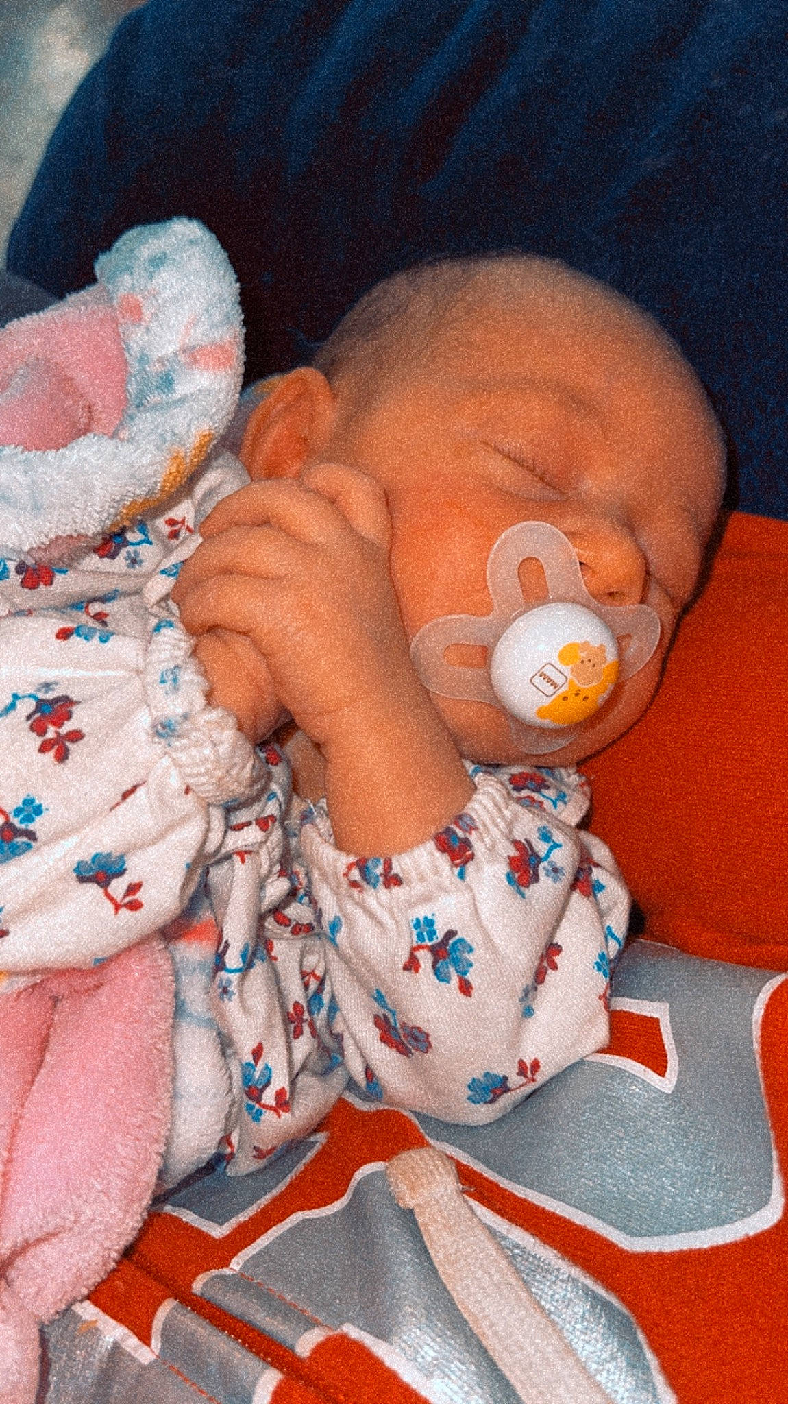 Adelaide joined the competition — help win amazing prizes! baby, baby_products, baby_sleeping, baby_toddler_clothing, cheek, child, comfort, ear, finger, human_body, mouth, nail, nose, orange, pattern, person, pink, skin, textile, thumb