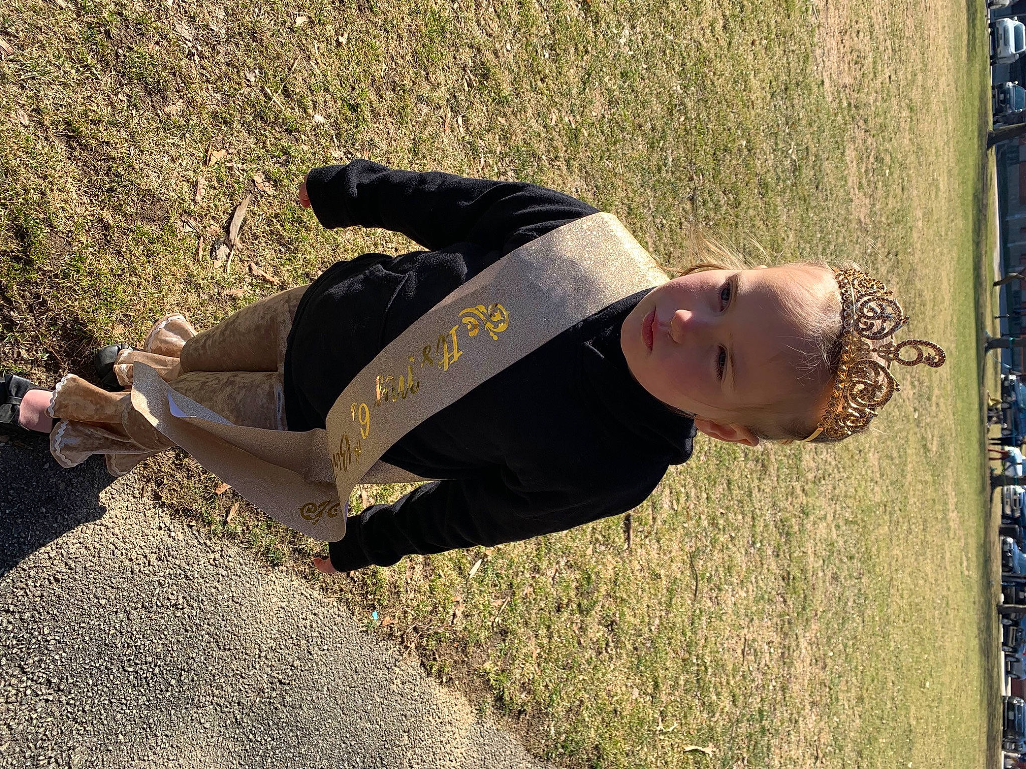 Adeline is registered to the contest to win money with this photo: eyewear, fun, grass, grass_family, happy, landscape, leisure, people_in_nature, person, recreation, shadow, sitting, smile, soil, street_fashion, tints_and_shades, toddler, tree, wood