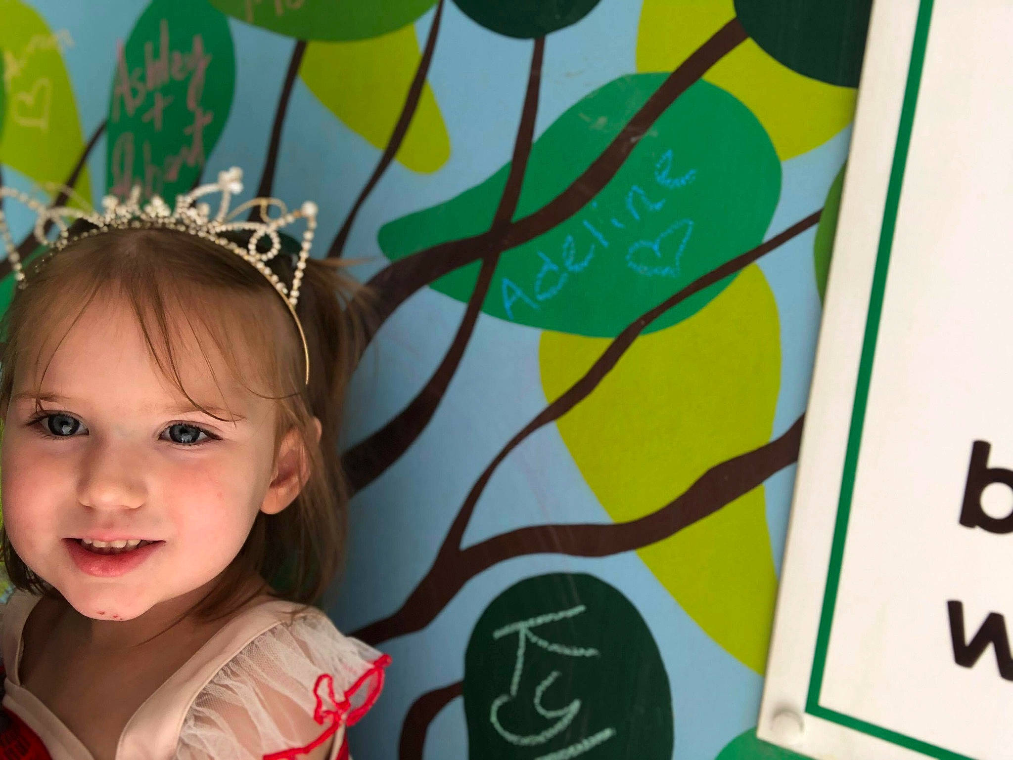 Adeline joined the competition — help win amazing prizes! adaptation, art, child, ear, face, green, hair_accessory, happy, head, headband, joy, person, plant, room, smile, toddler, tree, yellow