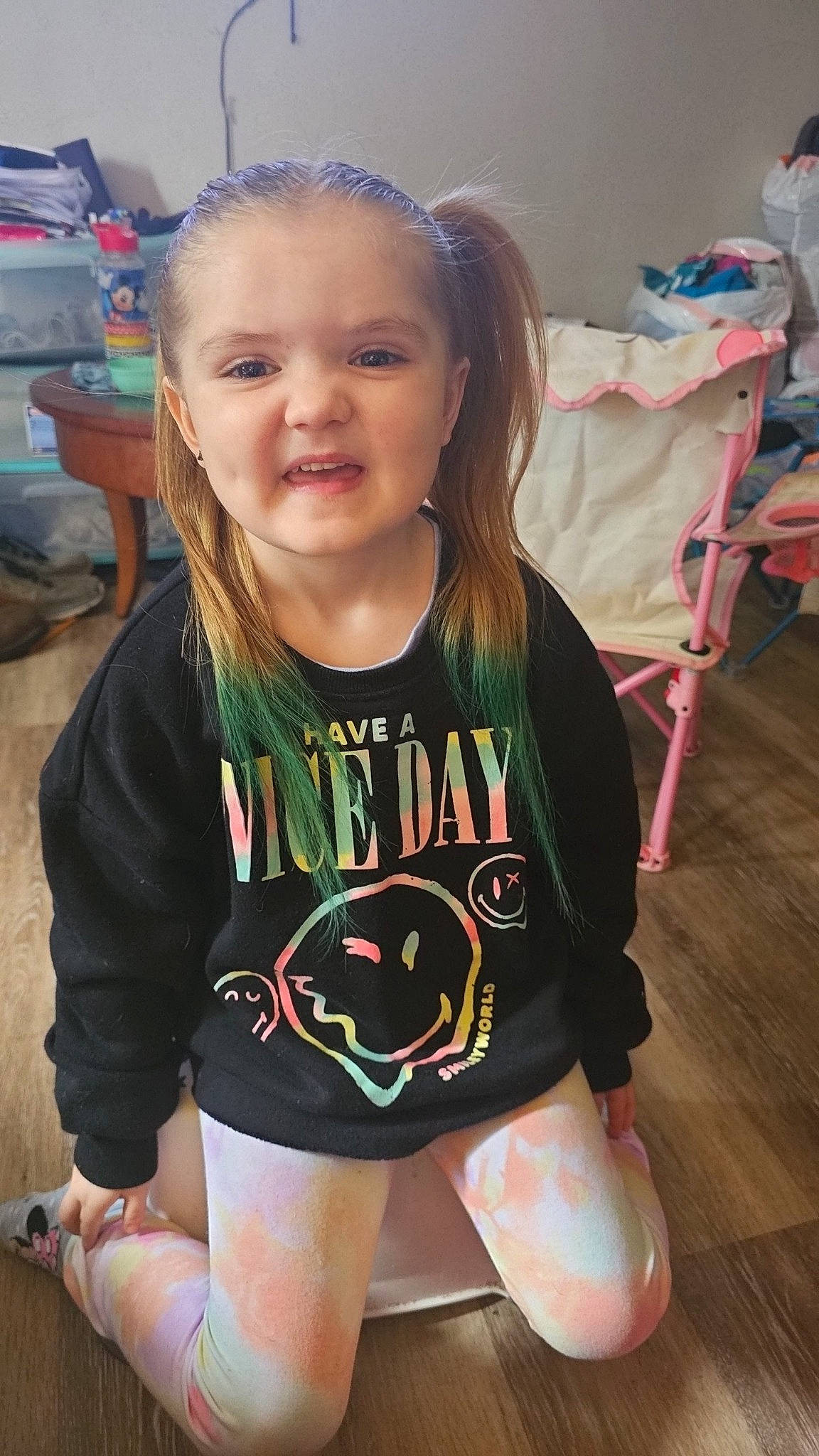Ryleigh joined the competition — help win amazing prizes! baby_toddler_clothing, chair, child, event, fun, hairstyle, happy, human_leg, knee, long_hair, mouth, neck, person, skin, sleeve, sportswear, t_shirt, thigh, toddler, trunk