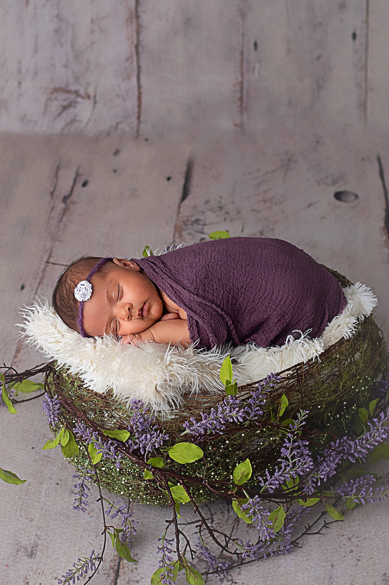 Meilani is registered to the contest to win money with this photo: baby, child, comfort, fashion_accessory, flower, fun, fur, grass, headwear, linens, pattern, people_in_nature, person, petal, photo_shoot, portrait_photography, purple, sitting, sleep, winter