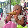 baby, bracelet, child, clothing, daylight, earring, eating, face, greenery, happy, high_chair, ice_cream_cone, messy, outdoor, people, pink, porch, summer, toy, white