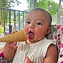 baby, bracelet, child, clothing, cone, cute, expression, food, girl, greenery, happy, high_chair, ice_cream, messy_face, outdoor, porch, sitting, snack, summer, tongue_out