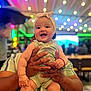 Eliana joined the competition — help win amazing prizes! baby, child, smiling, headband, hands, indoor, bokeh, colorful, happy, person, infant, holding, cute, portrait, people, clothing, bright, cheerful, event, celebration