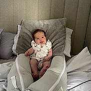 Lottie joined the competition — help win amazing prizes! baby, infant, lounger, bed, pillow, blanket, headboard, smiling, child, clothing, indoor, comfort, soft, cute, person, young, rest, sleeping_area, fabric, room