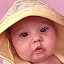 baby, infant, face, hood, yellow_towel, soft_texture, close_up, portrait, curious, cute, skin, eyes, mouth, pink_background, child, newborn, expression, warmth, indoors, wrapped