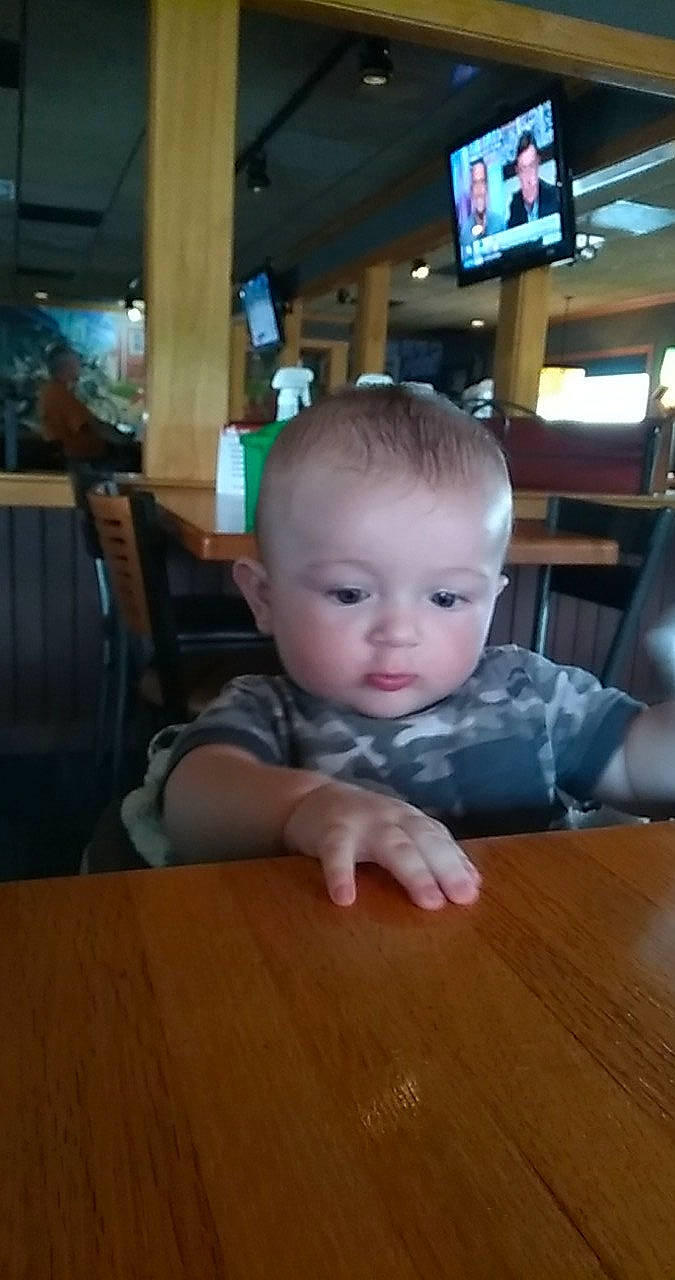 Konnor joined the competition — help win amazing prizes! baby, cheek, child, crawling, face, floor, flooring, fun, hardwood, head, person, sitting, smile, toddler, wood